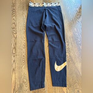 Nike Black Leggings with Gold Swoosh and black and gold Branded Waistband